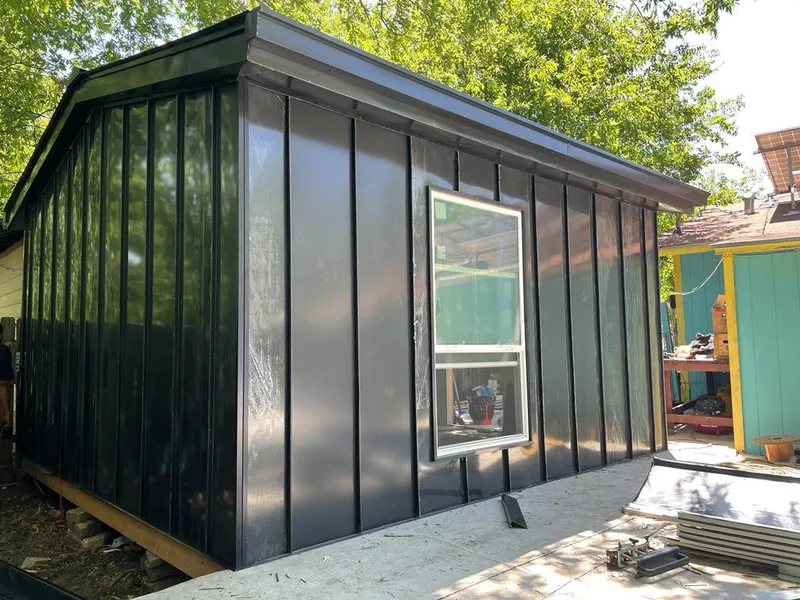 Black standing seam metal wall panels for Roof Inspection in Courtland